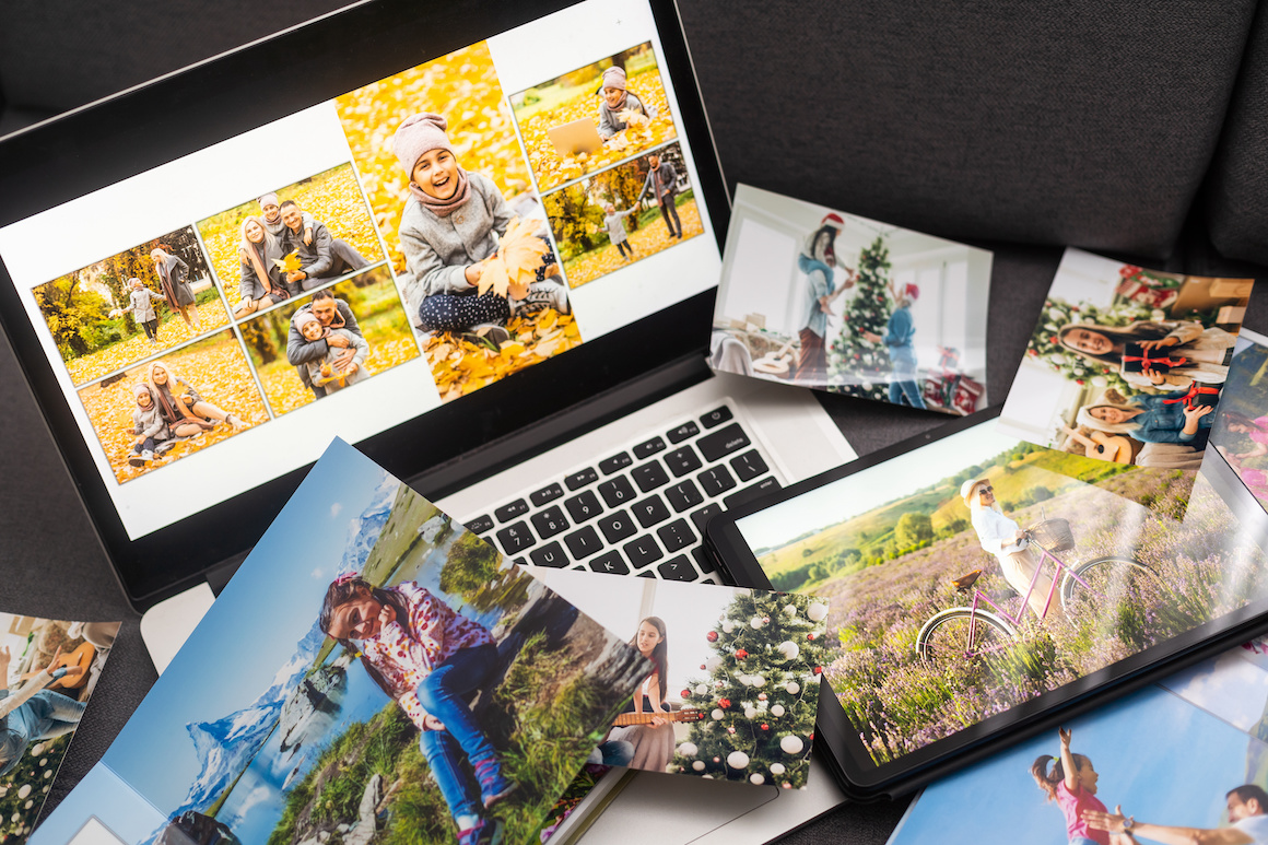 Laptop with photo, photoalbum, album.