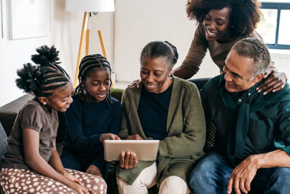 Three generation family using tablet
